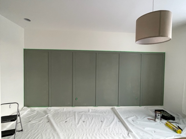 Panel wall with once coat of evergreen fog by Sherwin Williams.