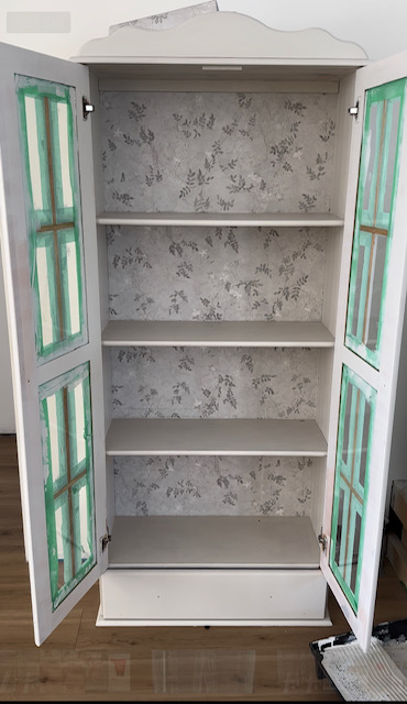Wallpapered and painted china cabinet.