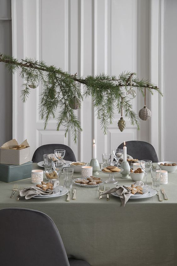 branch over Christmas table setting