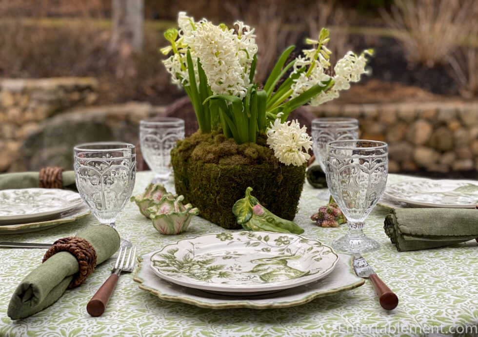 Green on green easter table setting idea with white flowers 