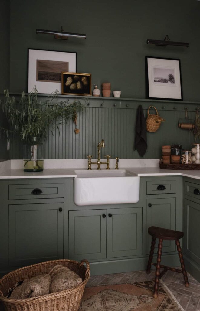 moody green laundry room design