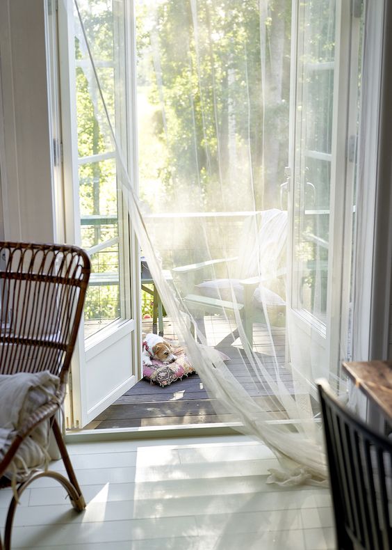 airy curtains over a door