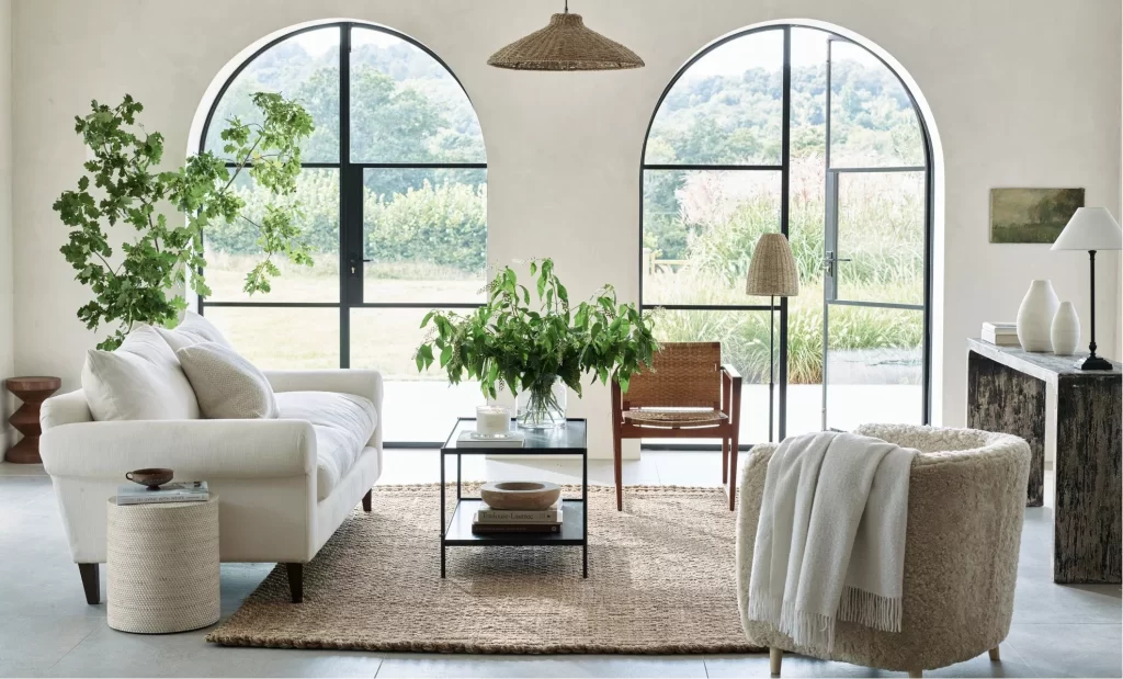 Organic modern living room with arched windows