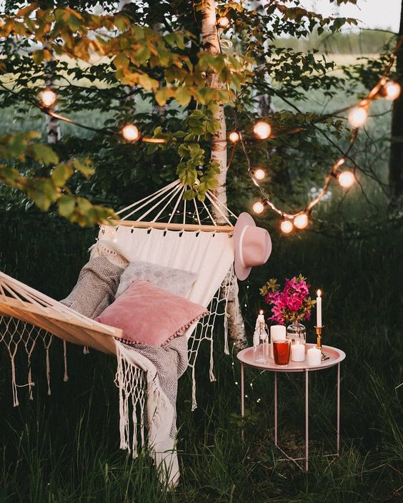 hammock with string lights in backyard design