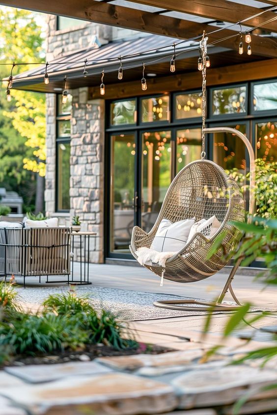 egg chair in a beautiful backyard design
