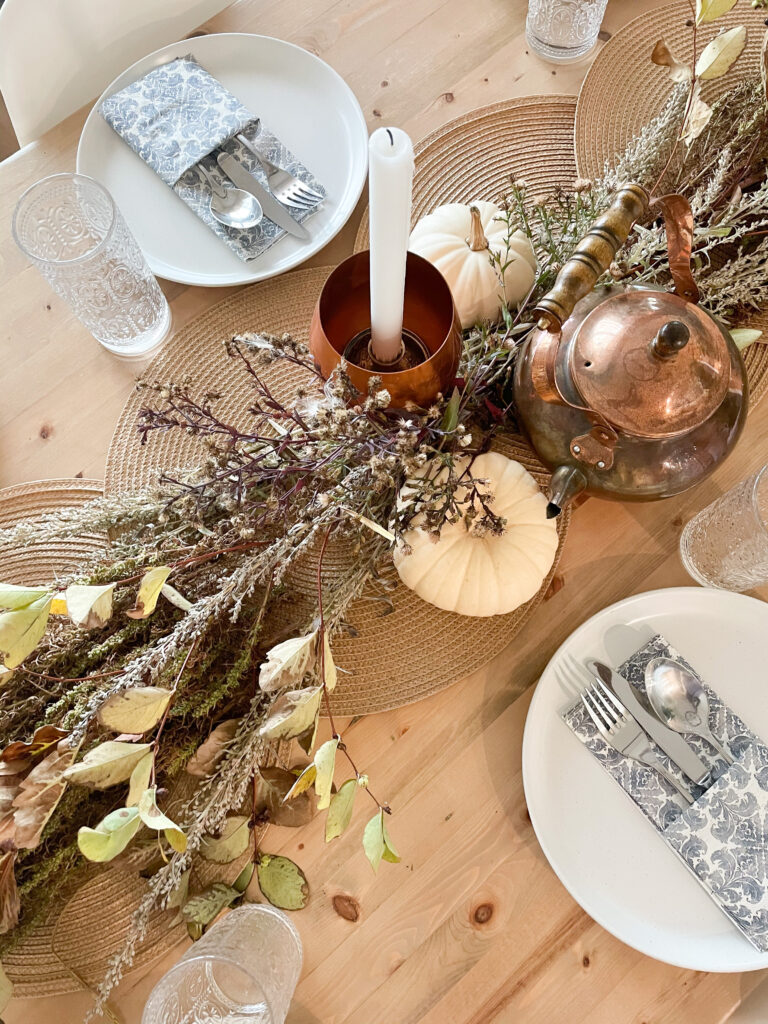 thanksgiving centerpiece decor idea with stems and white pumpkins