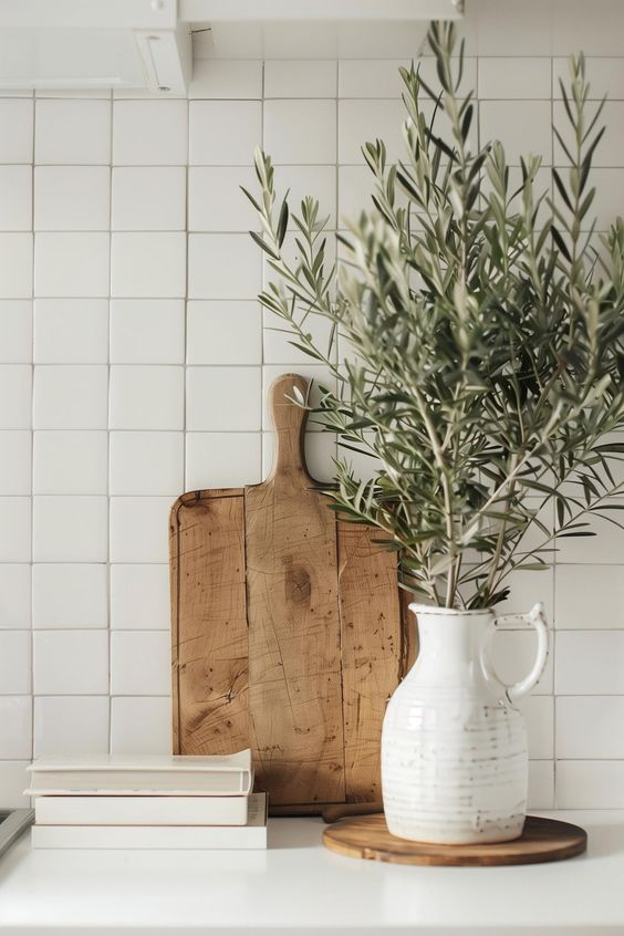 Pretty olive stems on kitchen counter