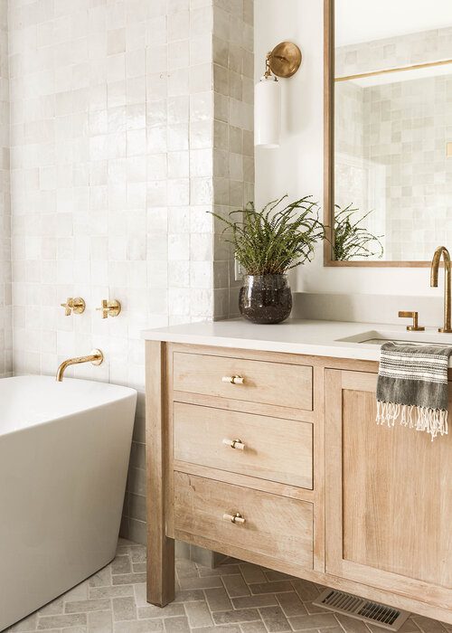 Warm cabinets in master bathroom design